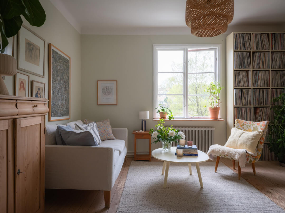A Soft Color Palette and a Charming Kitchen in a Swedish Apartment 13 large window scandinavian living room
