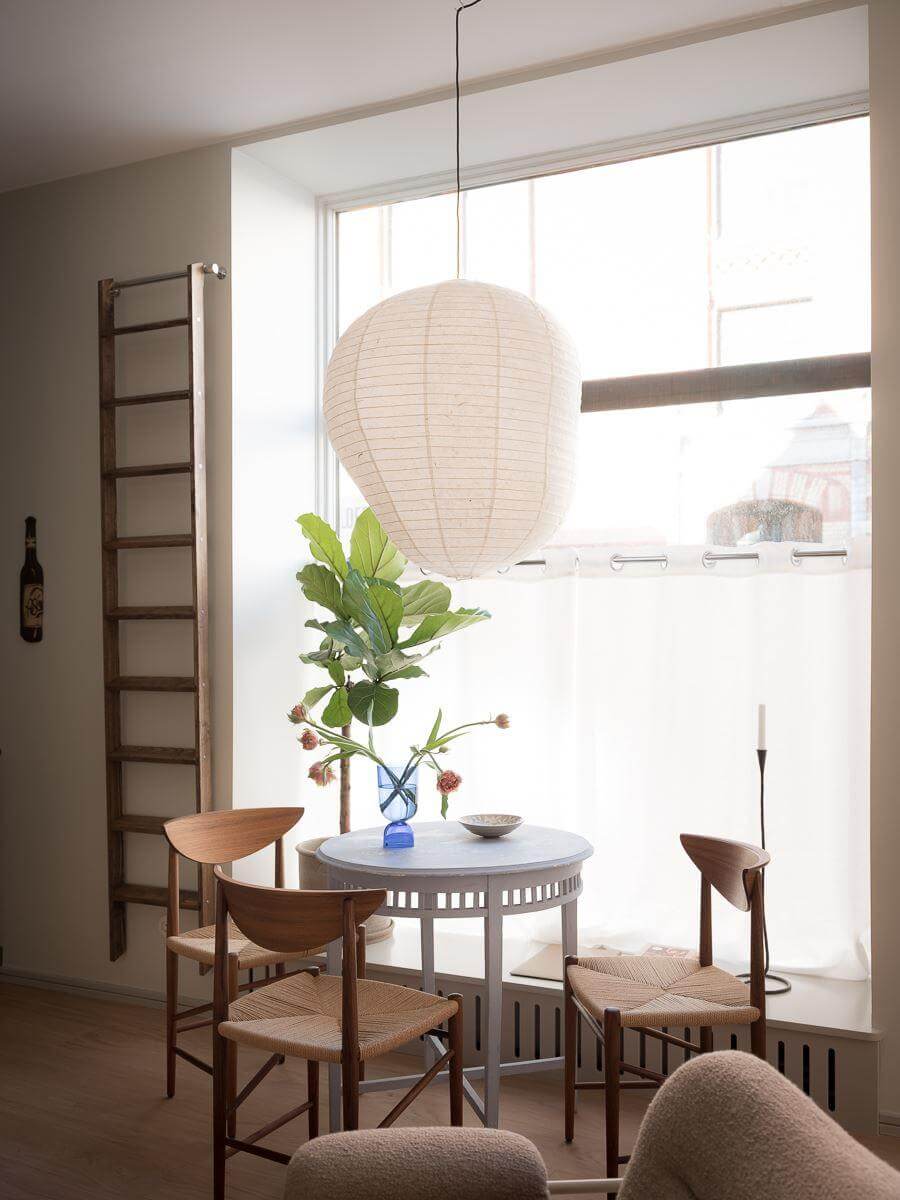 A Modern Split-Level Apartment in a Former Bakery 14 large window small round dining table