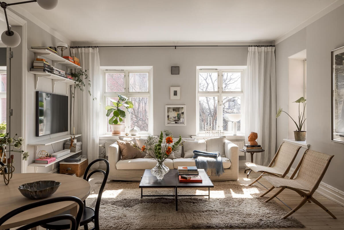 Gray Tones and a Classic Kitchen in a Swedish Apartment 1 large windows light gray walls living room