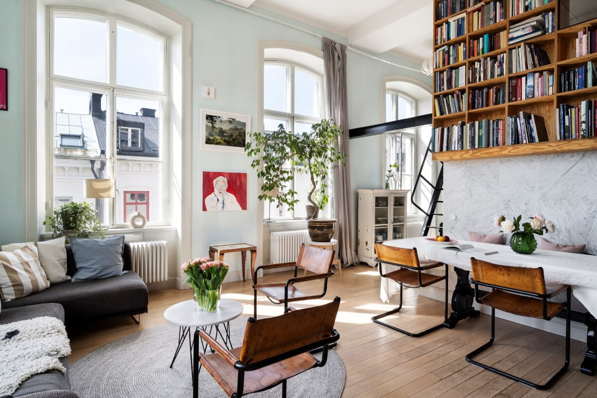Pale Blue Walls and Huge Windows in a Swedish Loft Apartment 10 large windows loft living space