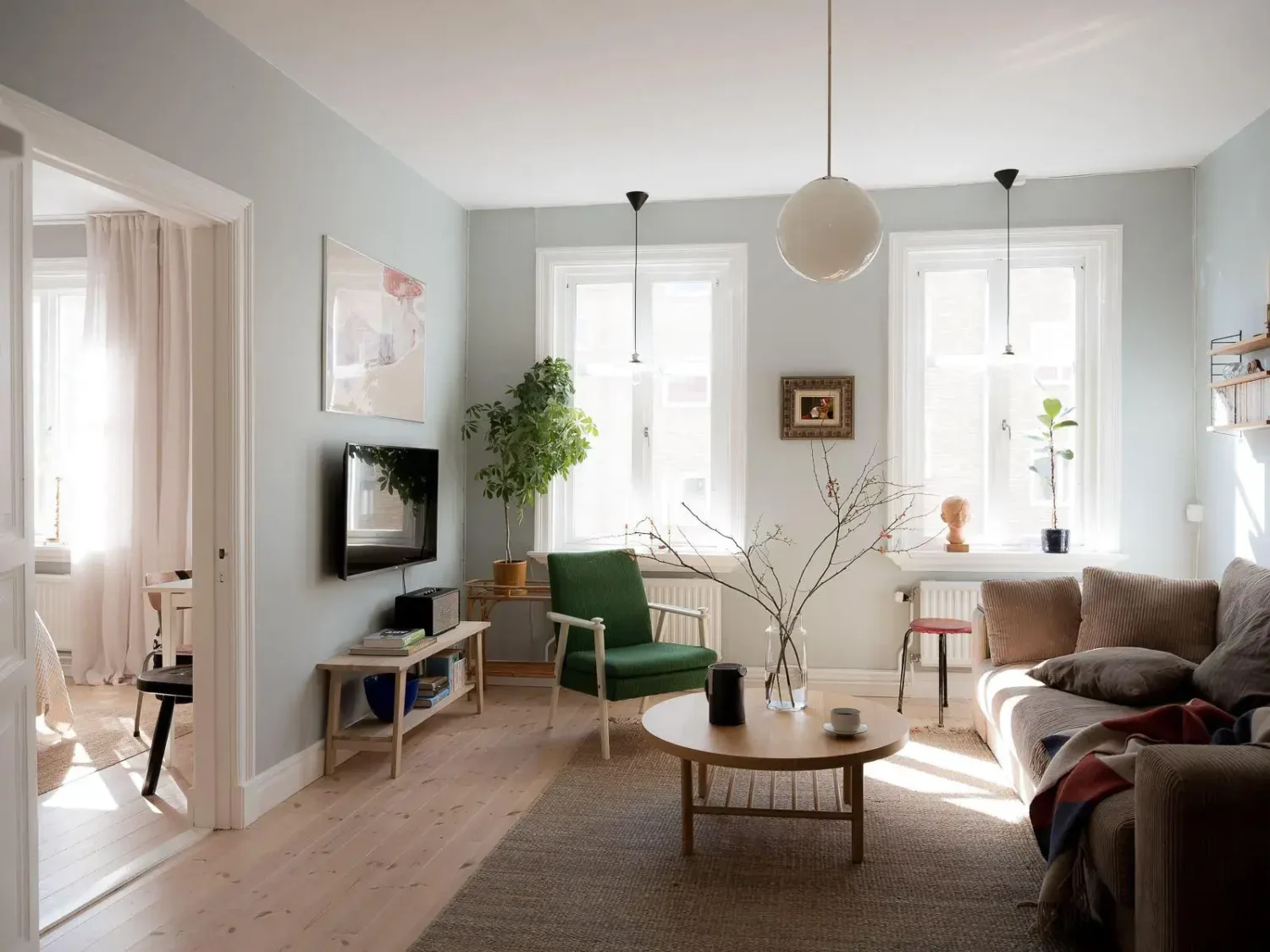 Gray Walls in a Renovated 19th-Century Gothenburg Apartment 6 large windows scandi living room