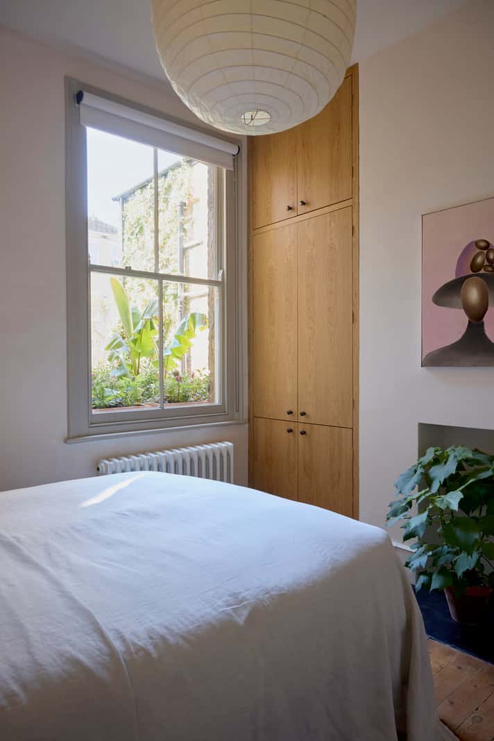 Bespoke Oak Cabinets and Plaster Walls in a London Garden Apartment 18 light bedroom oak wardrobes large window