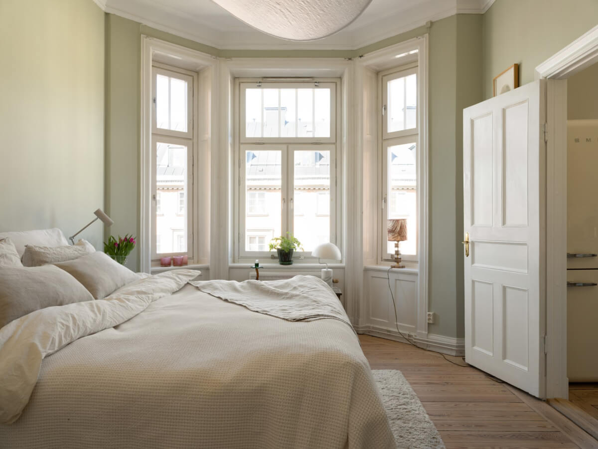 Turn-of-the-Century Charm and Site-Built Storage in a Stockholm Apartment 23 light bedroom wooden floor bay window