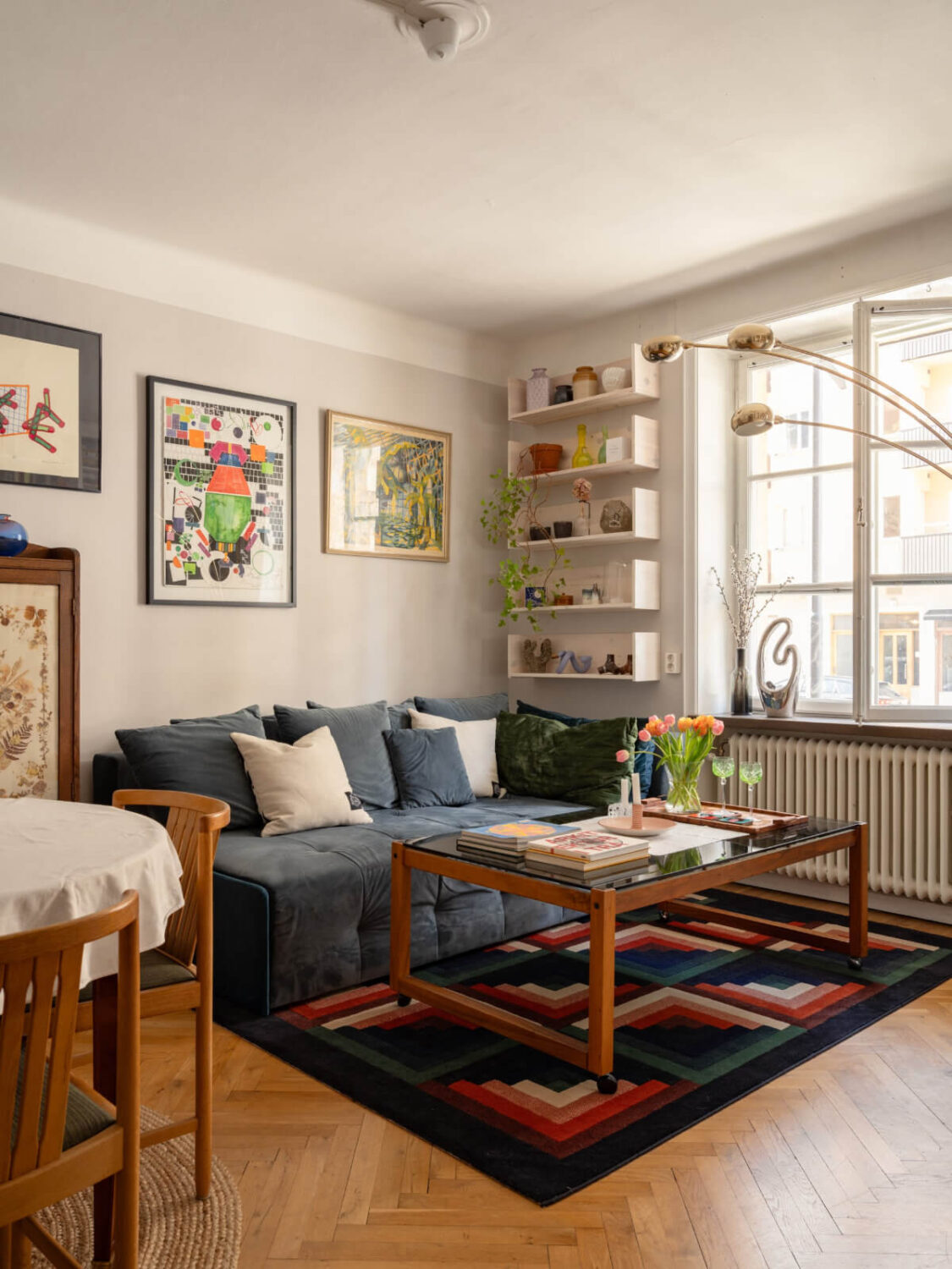 A Small, Cozy Apartment with Built-in Storage and Bookshelves 4 light gray living room herringbone parquet floor