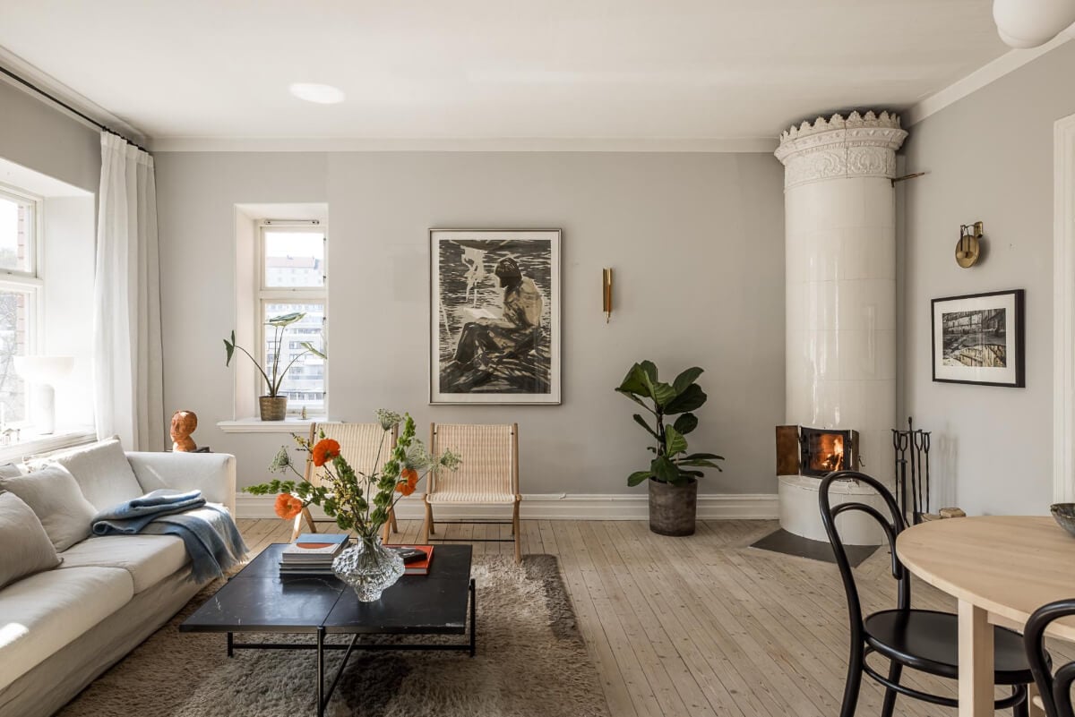 Gray Tones and a Classic Kitchen in a Swedish Apartment 3 light gray living room with fireplace