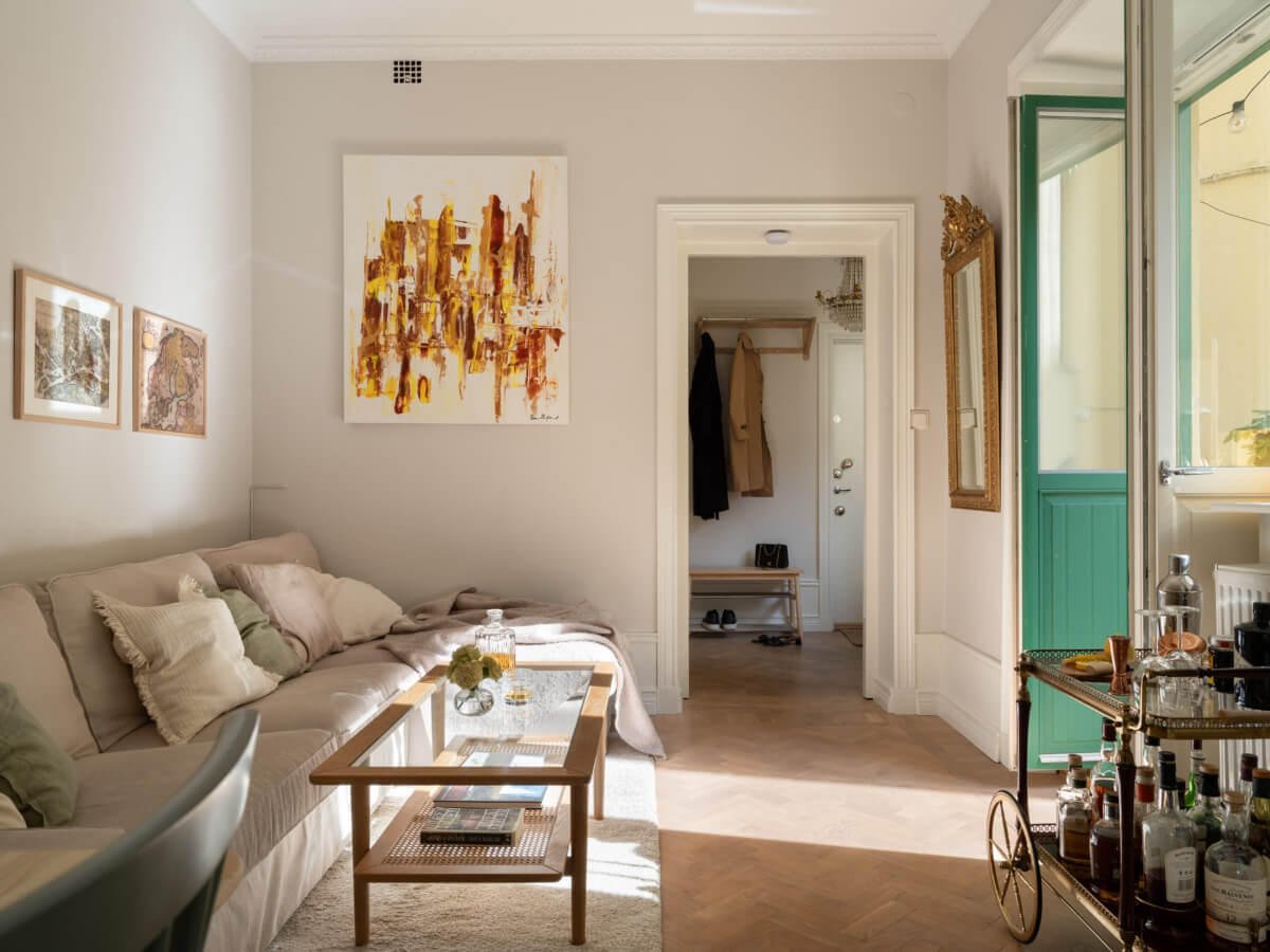 A Small Apartment with Green Color Accents and a Cozy Patio Terrace 5 light gray living room