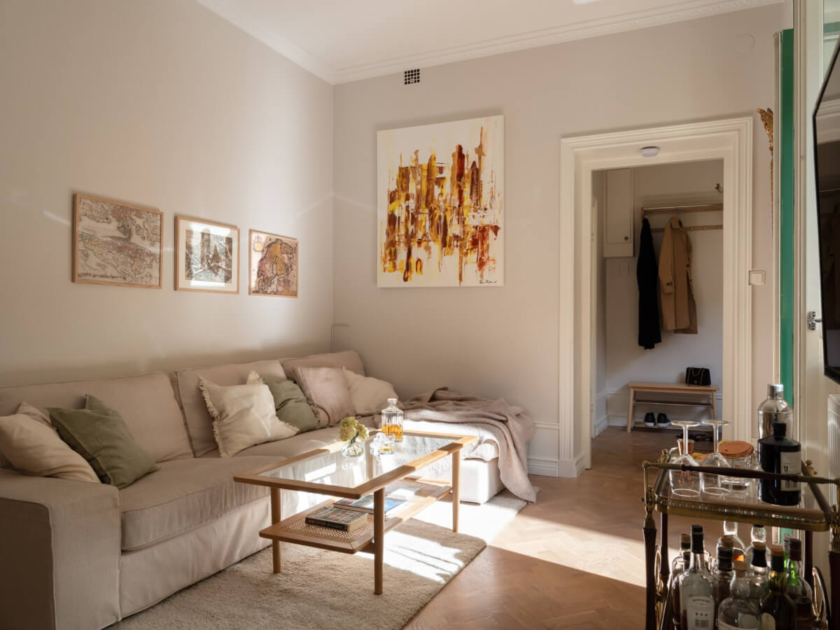 A Small Apartment with Green Color Accents and a Cozy Patio Terrace 4 light gray walls living room