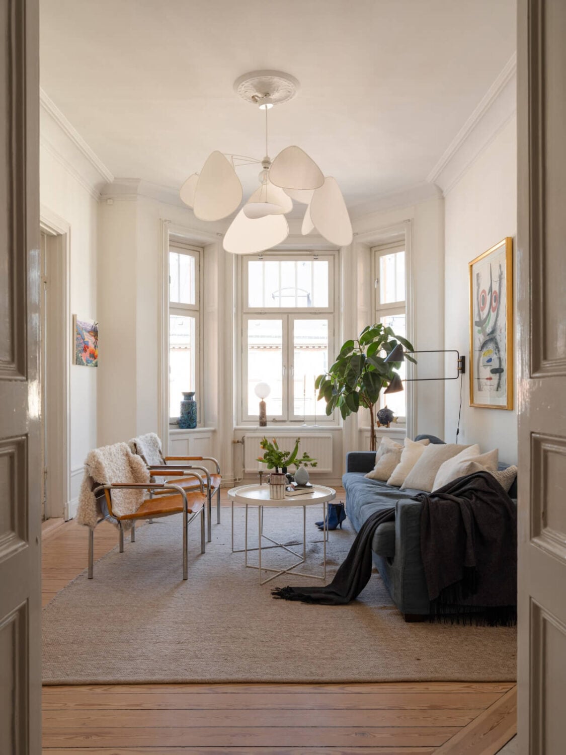 light scandinavian living room bay window wooden floor