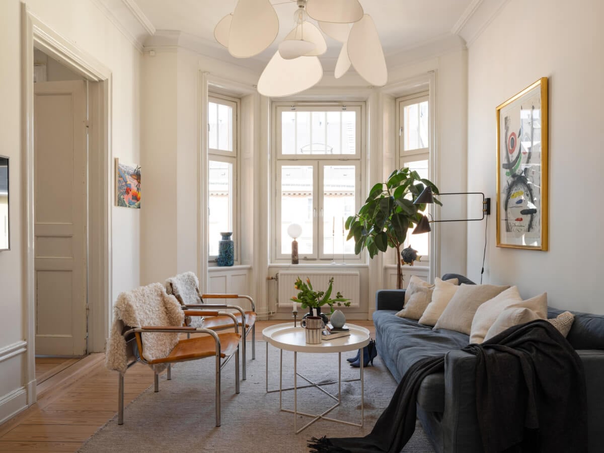 Turn-of-the-Century Charm and Site-Built Storage in a Stockholm Apartment 2 light swedish living room large bay window
