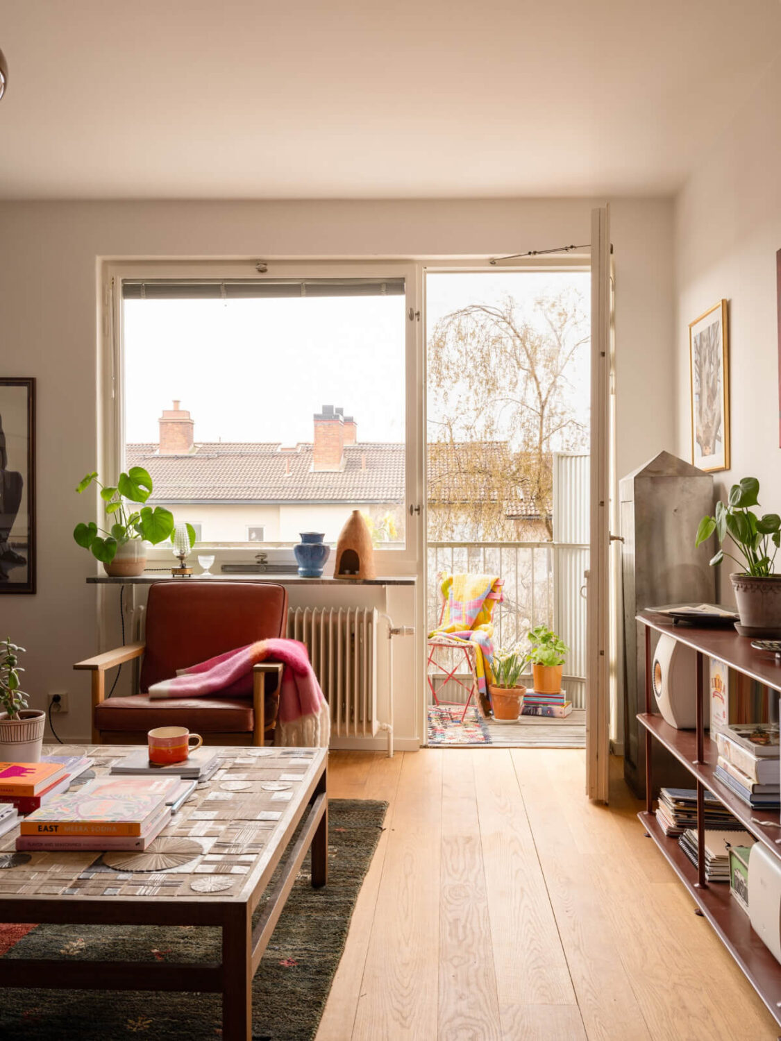 Color Accents in a Renovated Midcentury Apartment in Stockholm 7 living room balcony
