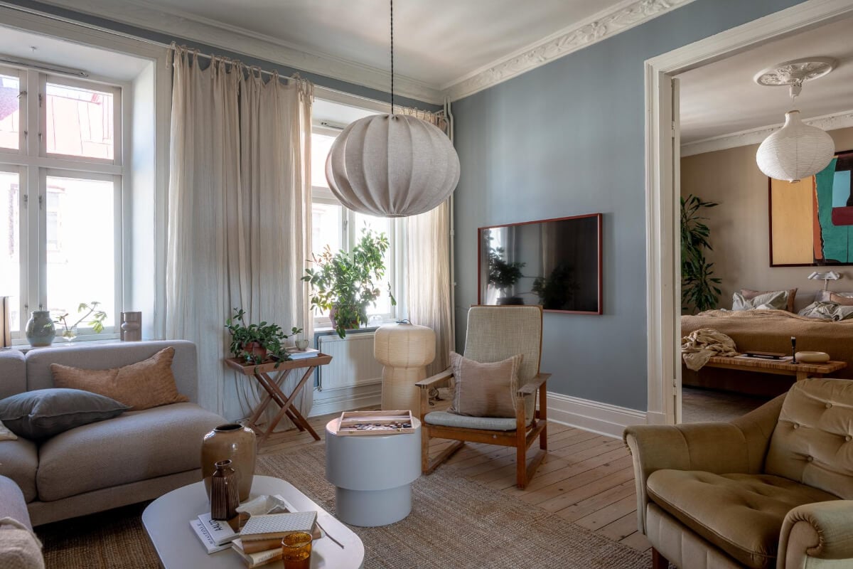 A Natural Color Palette, Period Features, & Grand Rooms in a Swedish Home 6 living room blue walls