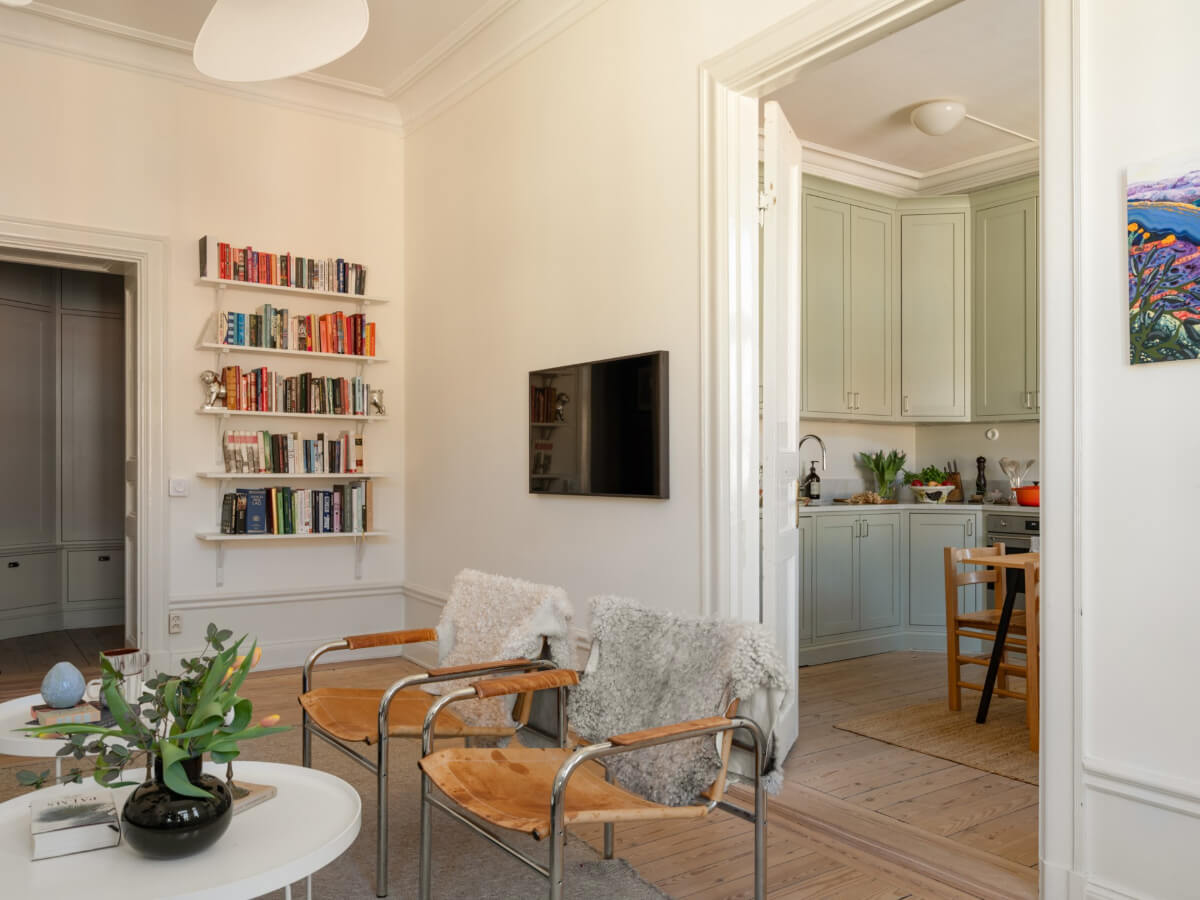 Turn-of-the-Century Charm and Site-Built Storage in a Stockholm Apartment 7 living room bookshelves