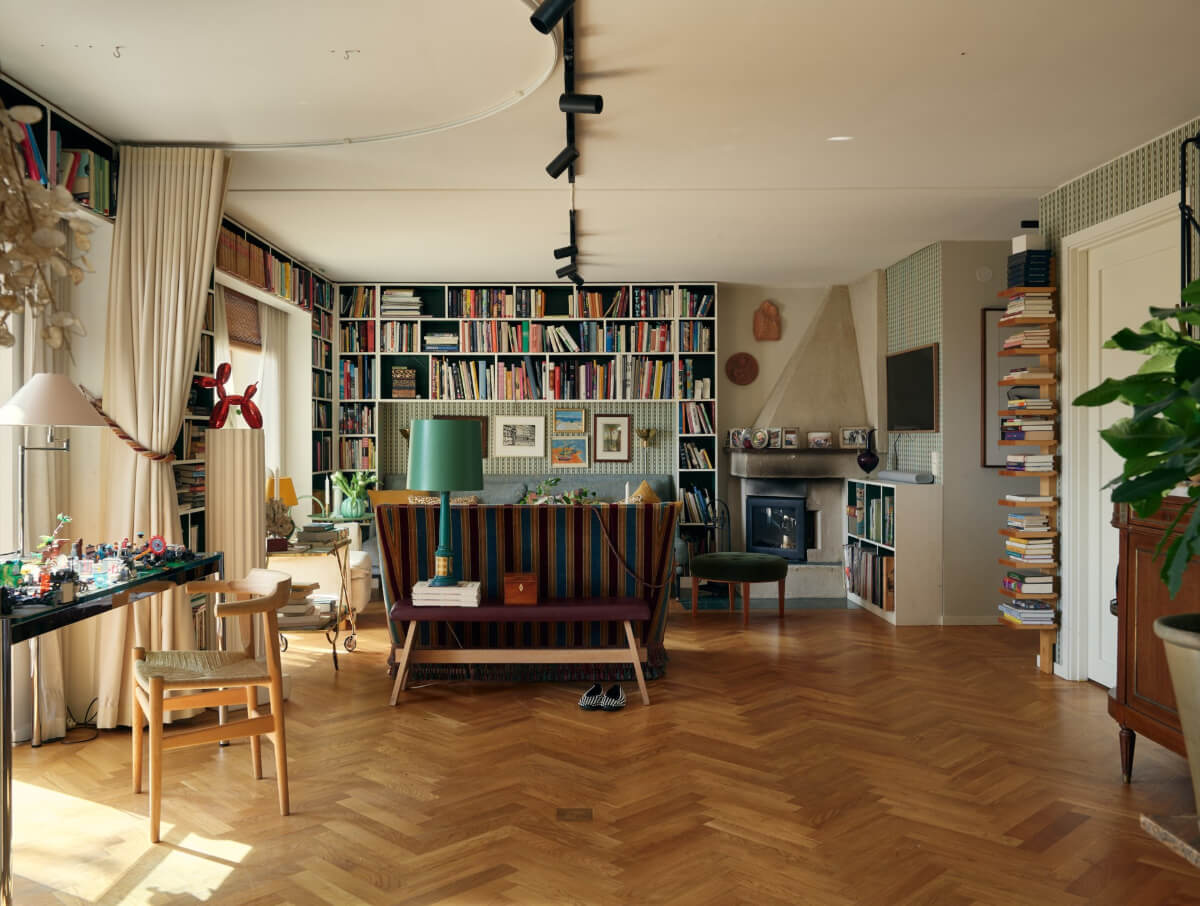 A Personal and Cozy 1960s Family Home in Sweden 26 living room bookshelves herringbone floor