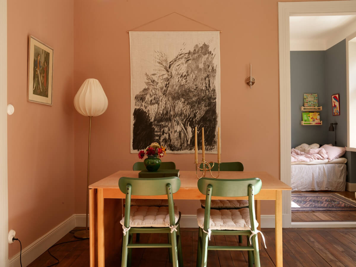 A Nature-Inspired Color Palette in a Stockholm Apartment 5 living room dining table green chairs