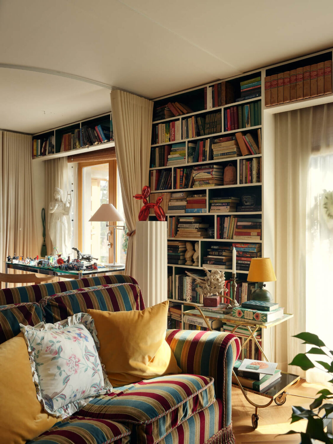 A Personal and Cozy 1960s Family Home in Sweden 29 living room filled with books