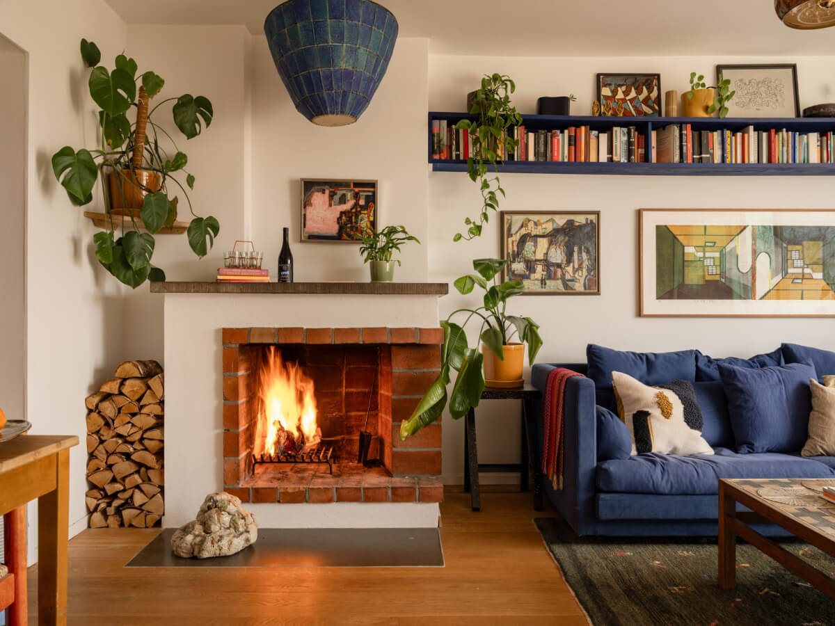 Color Accents in a Renovated Midcentury Apartment in Stockholm 2 living room fireplace