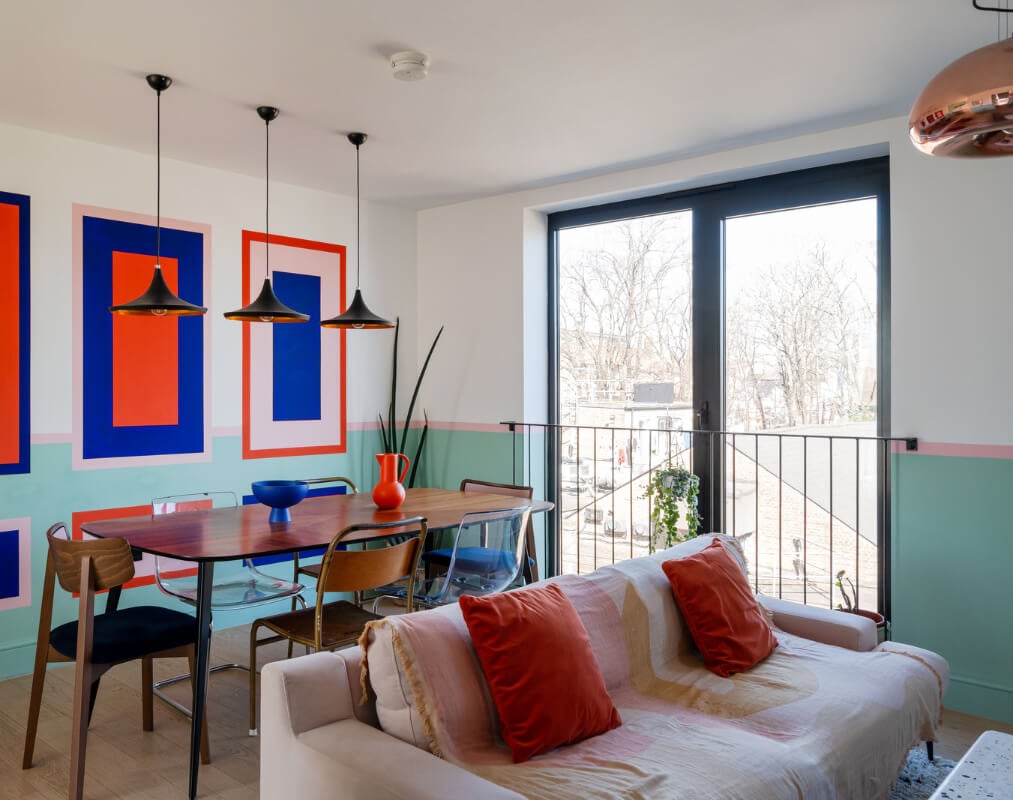 Arched Shapes and Hand-Painted Murals in a Joyful London Townhouse 9 living room half painted wall