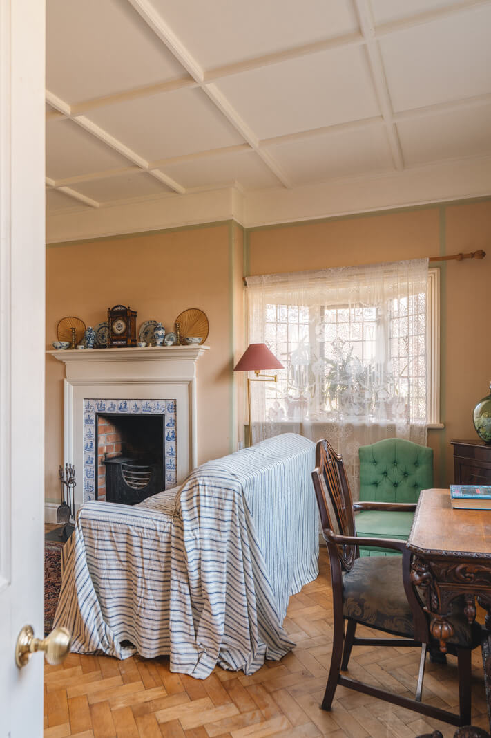 A Sage Green Kitchen in a Charming Arts and Crafts House 4 living room herringbone parquet floor