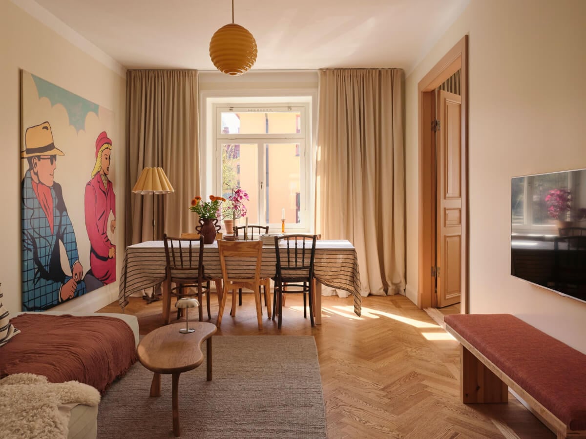 Warm, Natural Light in a Renovated Turn-of-the-Century Apartment 1 living room parquet floor warm tones