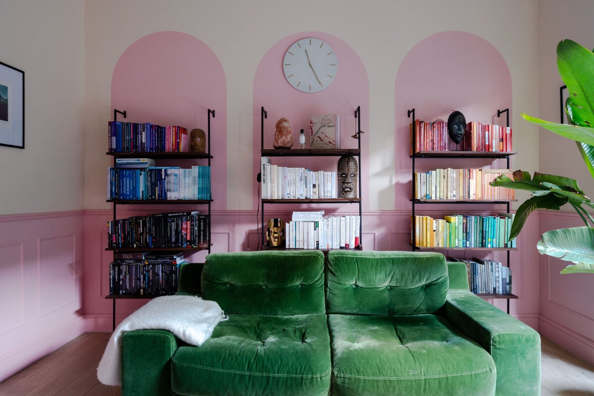 Arched Shapes and Hand-Painted Murals in a Joyful London Townhouse 2 living room pink paint arches bookshelves