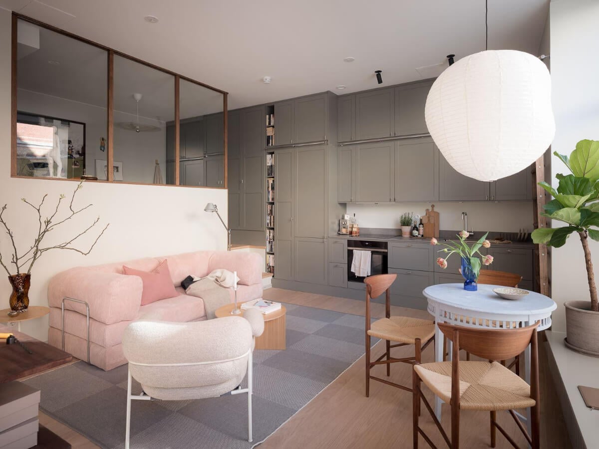A Modern Split-Level Apartment in a Former Bakery 1 living room pink sofa