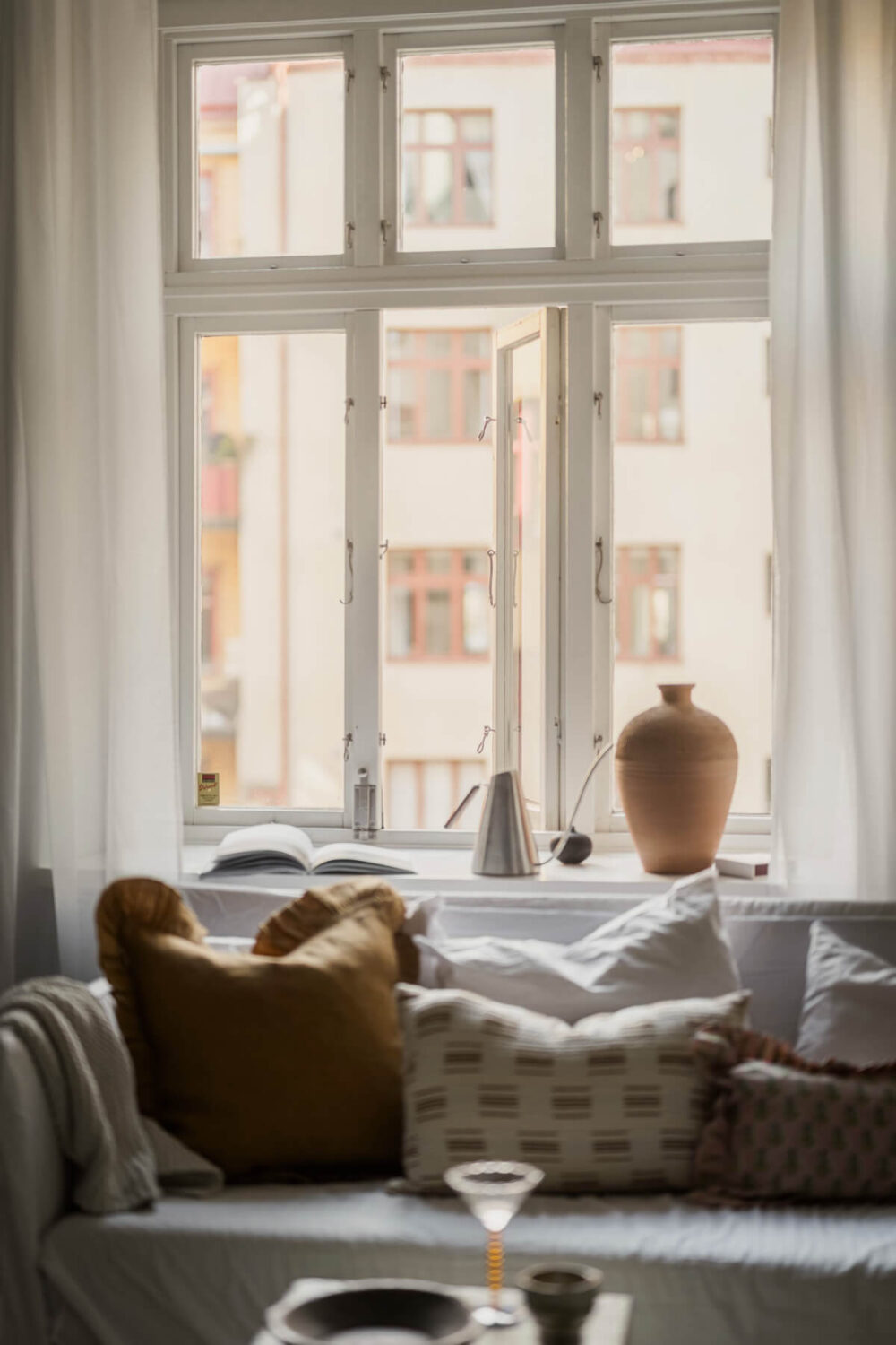 A Stylish Swedish Studio Apartment with a Blue Kitchen 11 living room window