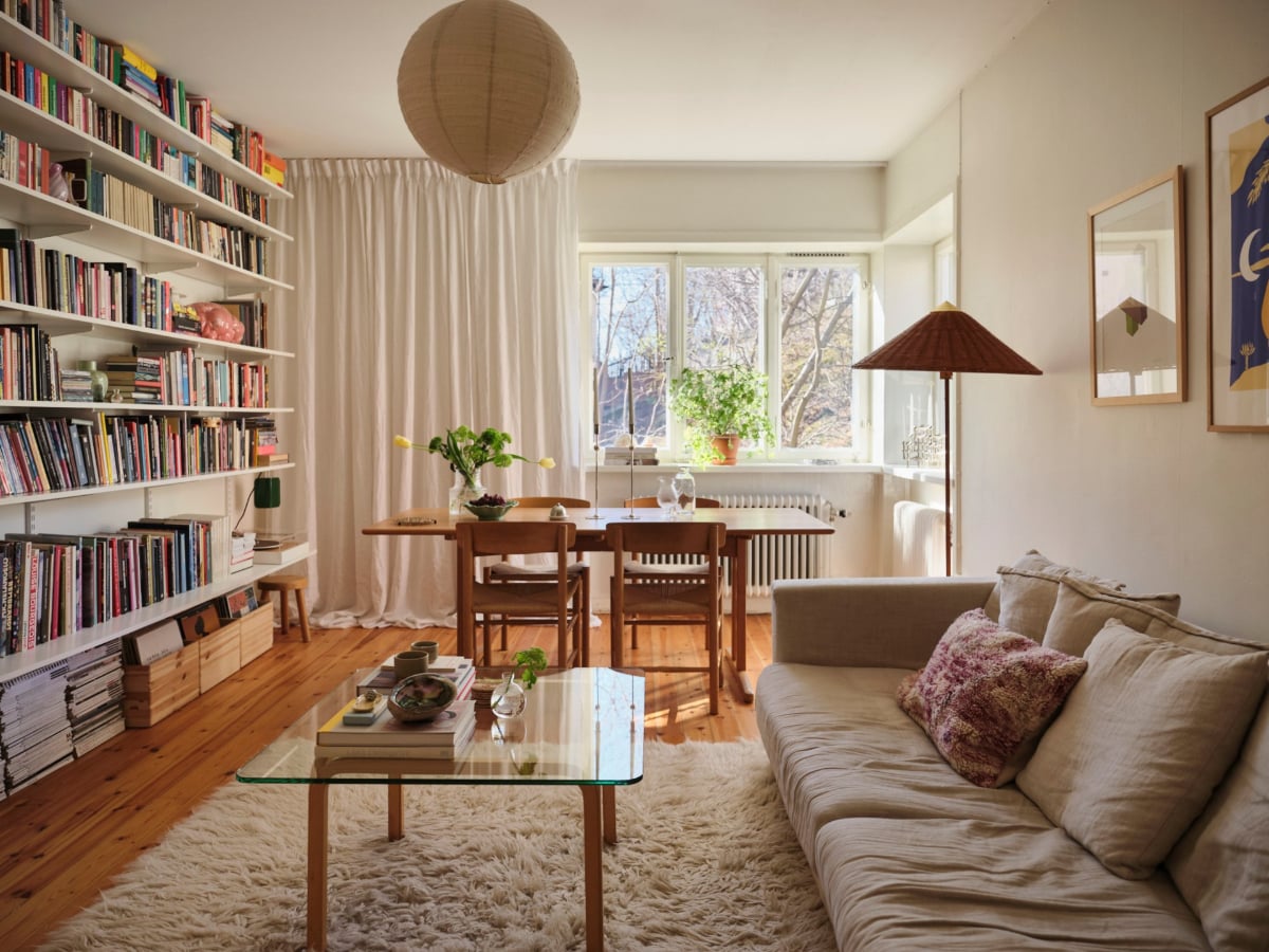 A Light-Filled Functionalist Apartment in Stockholm 1 living room with bookshelves