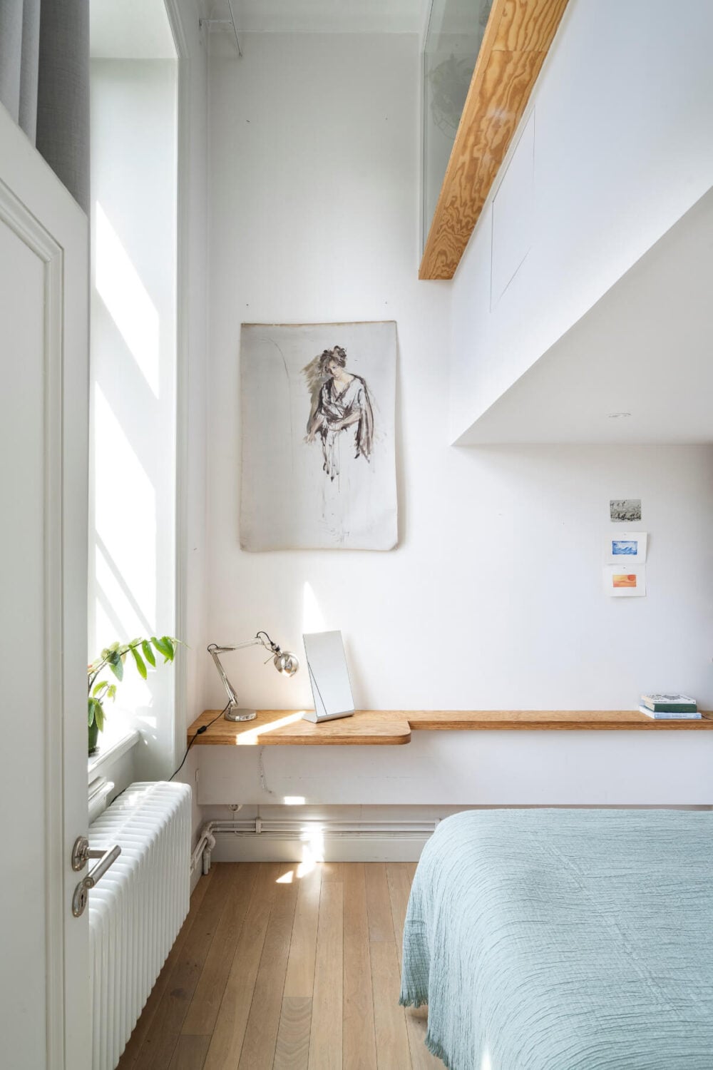 Pale Blue Walls and Huge Windows in a Swedish Loft Apartment 16 loft bedroom floating desk