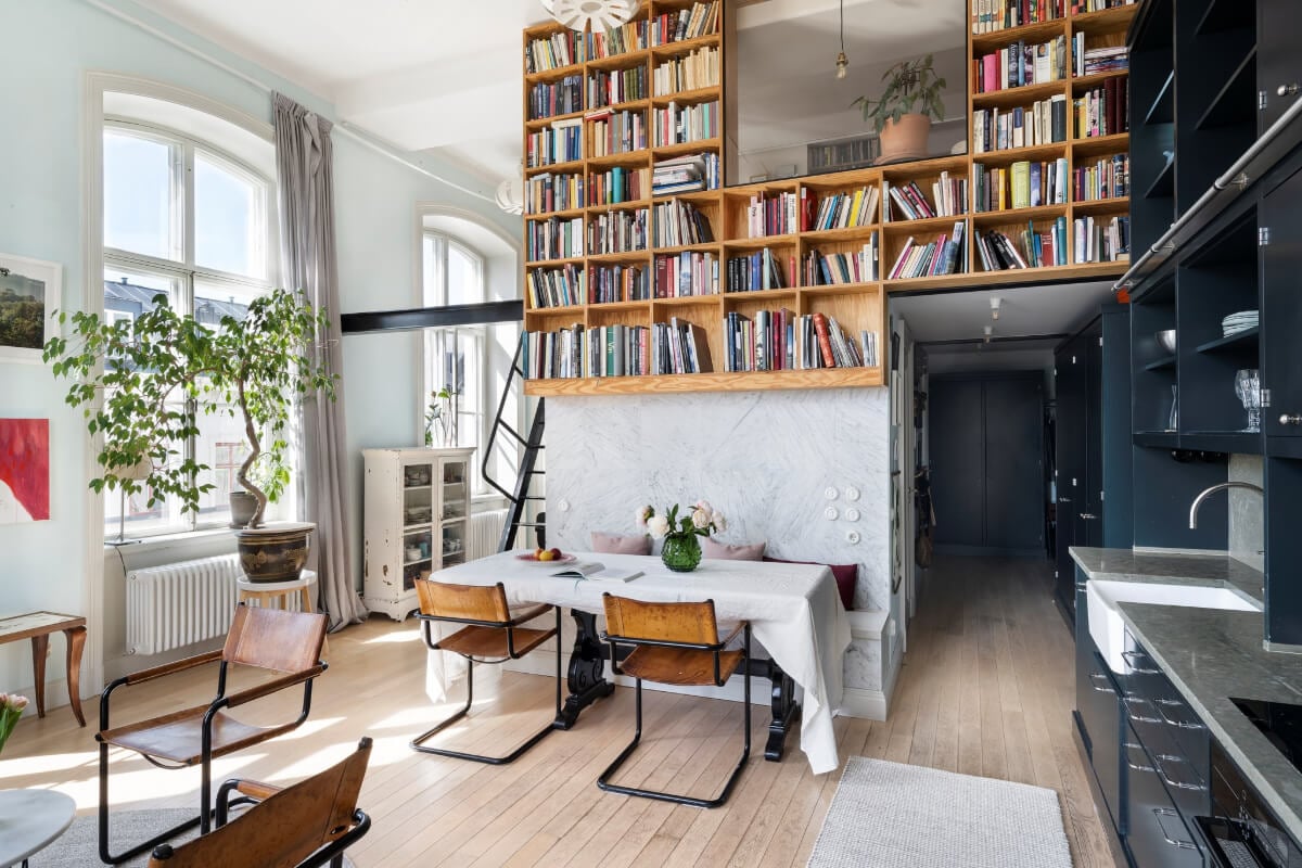 Pale Blue Walls and Huge Windows in a Swedish Loft Apartment 9 loft living space bookcases