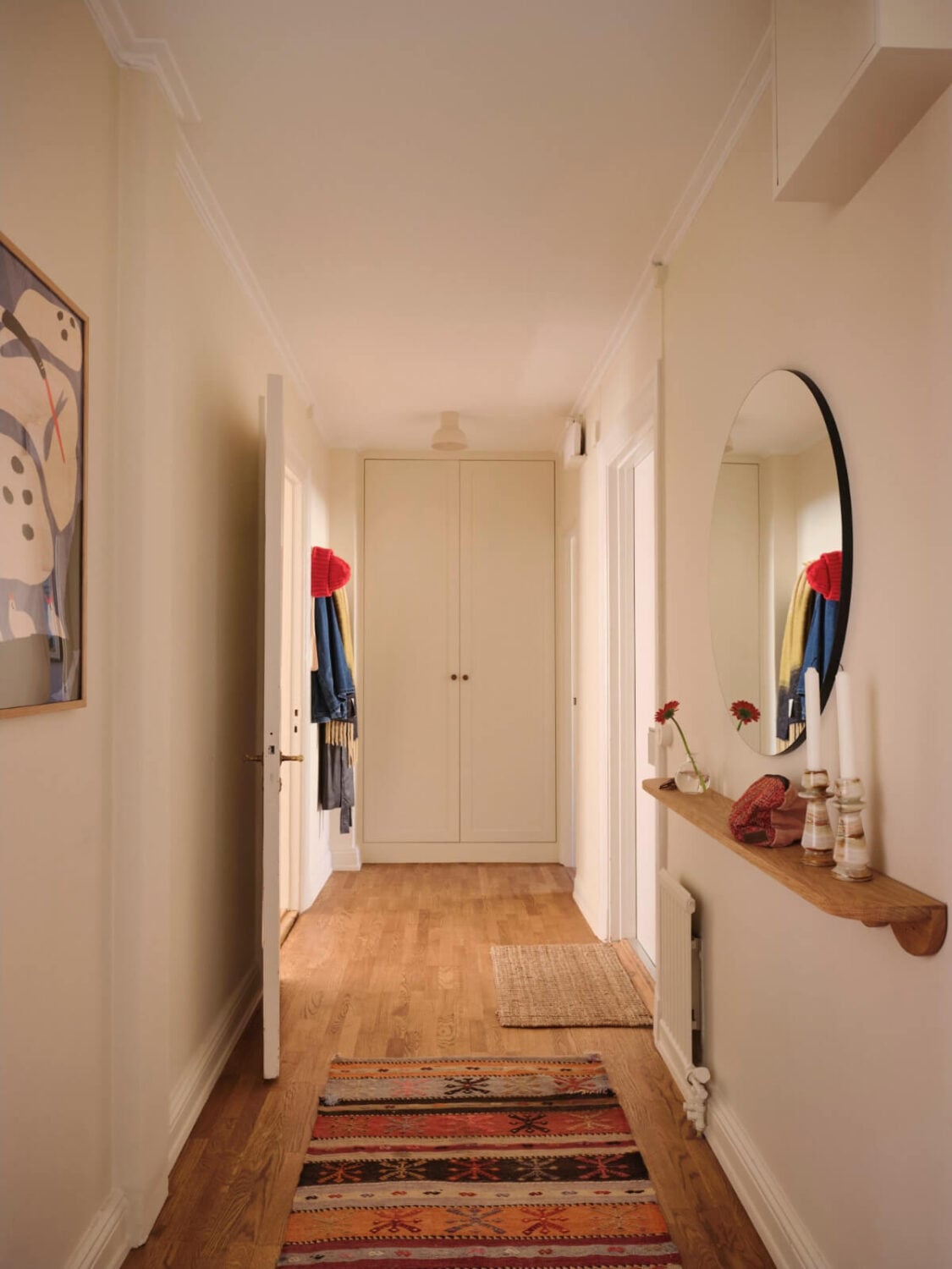 Warm, Natural Light in a Renovated Turn-of-the-Century Apartment 26 long hall built-in wardrobes round mirror
