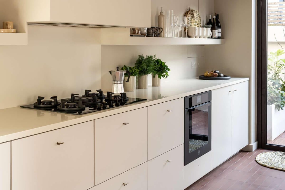 Natural Materials and Period Features in a Restored Victorian House 8 modern white kitchen terracotta floor