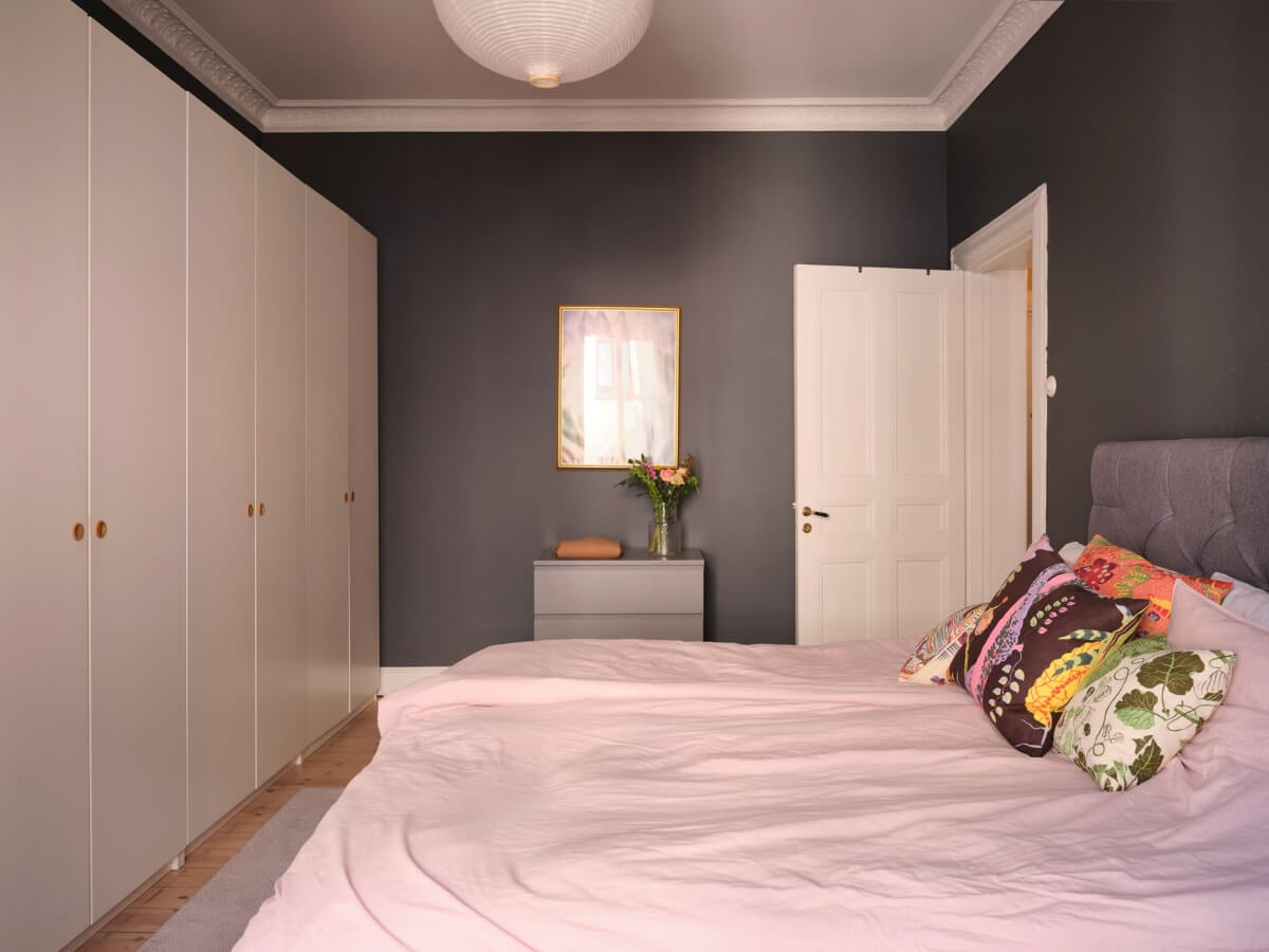 A Spacious Turn-of-the-Century Apartment with Nice Color Accents 19 moody bedroom white wardrobes