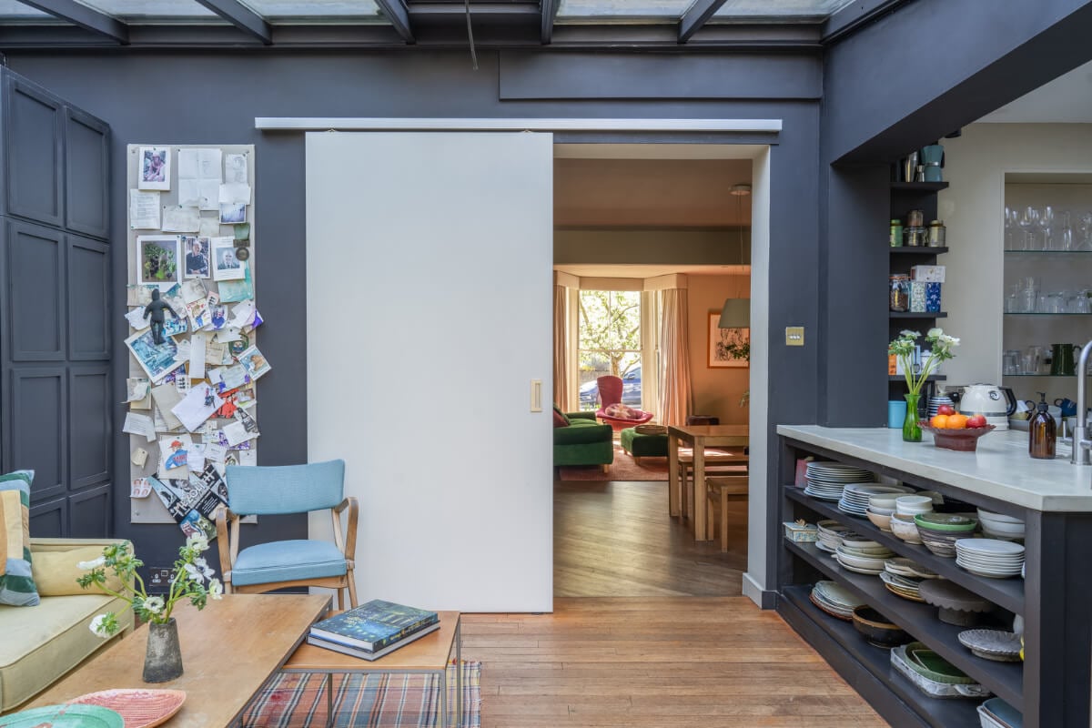 An Edwardian House with Muted Tones, Natural Materials, and a Landscaped Garden 8 moody gray kitchen living space