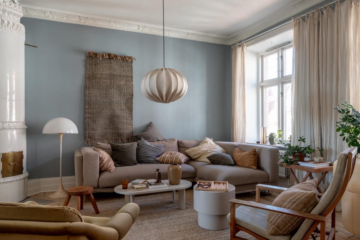 A Natural Color Palette, Period Features, & Grand Rooms in a Swedish Home 4 natural colored living room fireplace