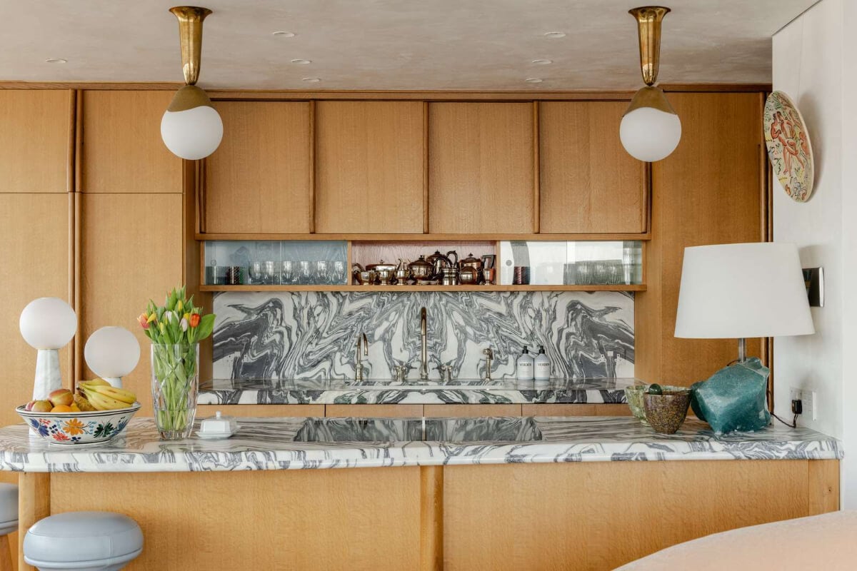 Oak and Marble in a Spectacular Brutalist Apartment in London 8 oak kitchen