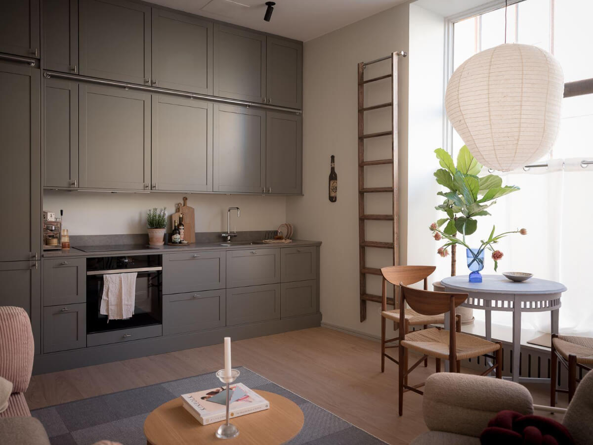 A Modern Split-Level Apartment in a Former Bakery 4 open-plan living space gray kitchen small table