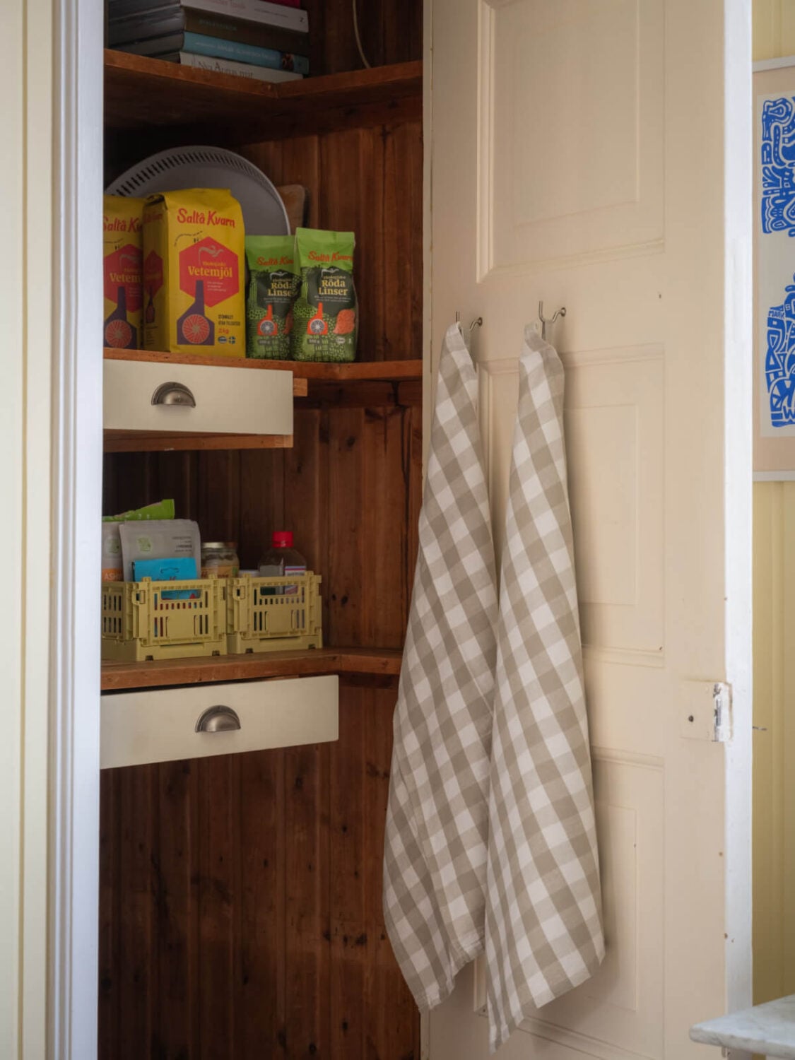 A Soft Color Palette and a Charming Kitchen in a Swedish Apartment 8 original kitchen pantry