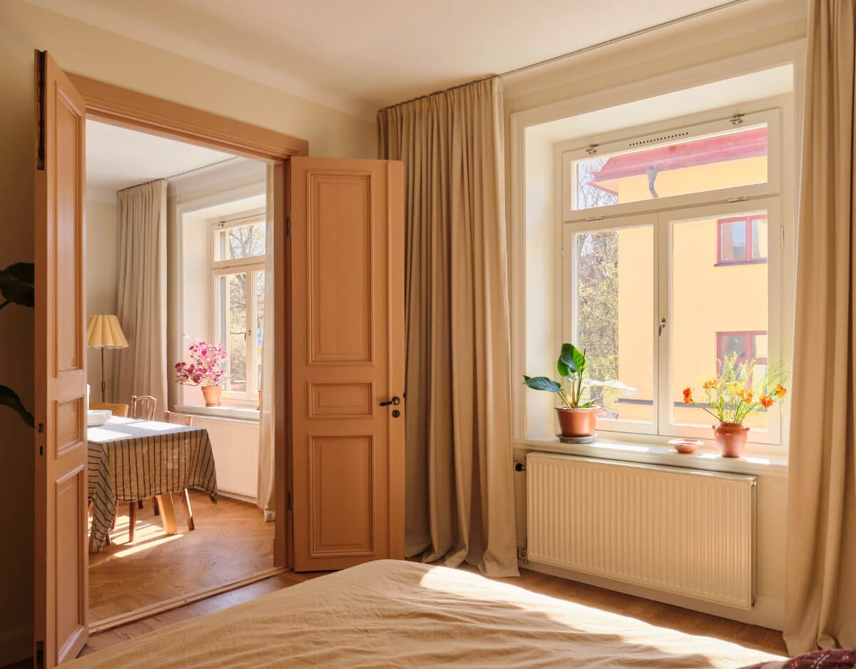 Warm, Natural Light in a Renovated Turn-of-the-Century Apartment 9 painted wooden doors bedroom
