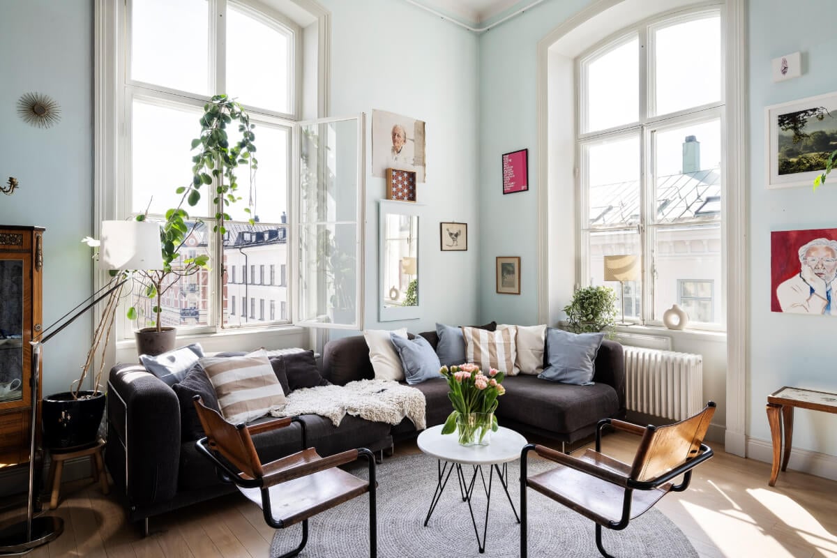 Pale Blue Walls and Huge Windows in a Swedish Loft Apartment 3 pastel blue walls living room large windows