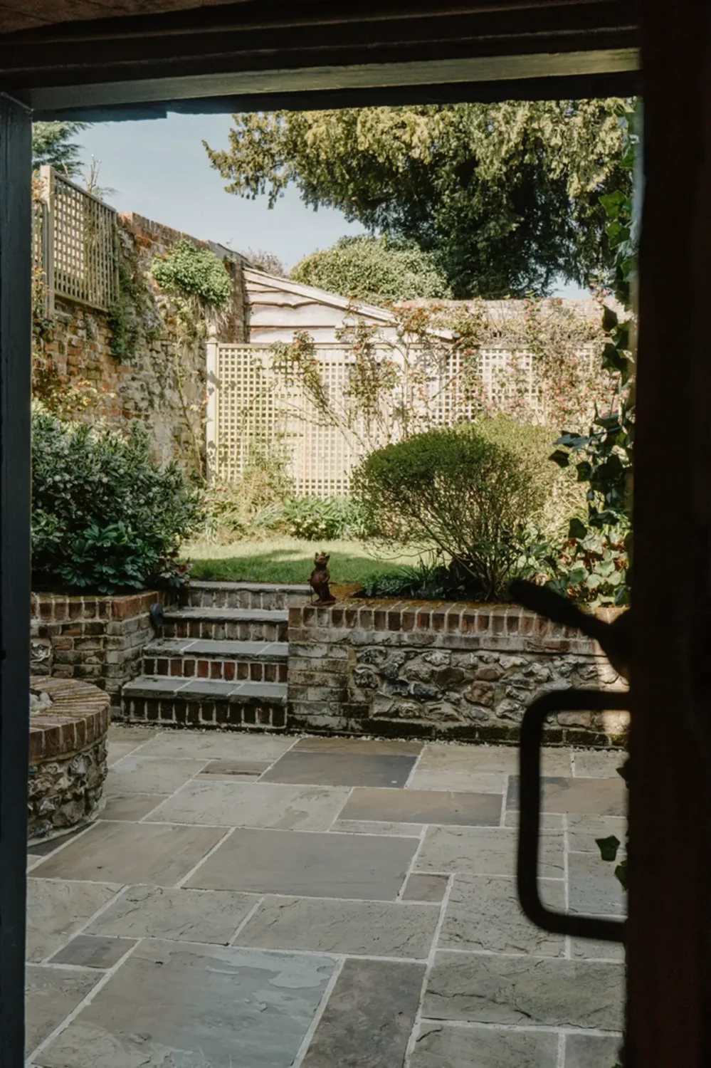 Serene Colors and Historic Elements in an Elizabethan Home in Wiltshire 24 paved terrace garden