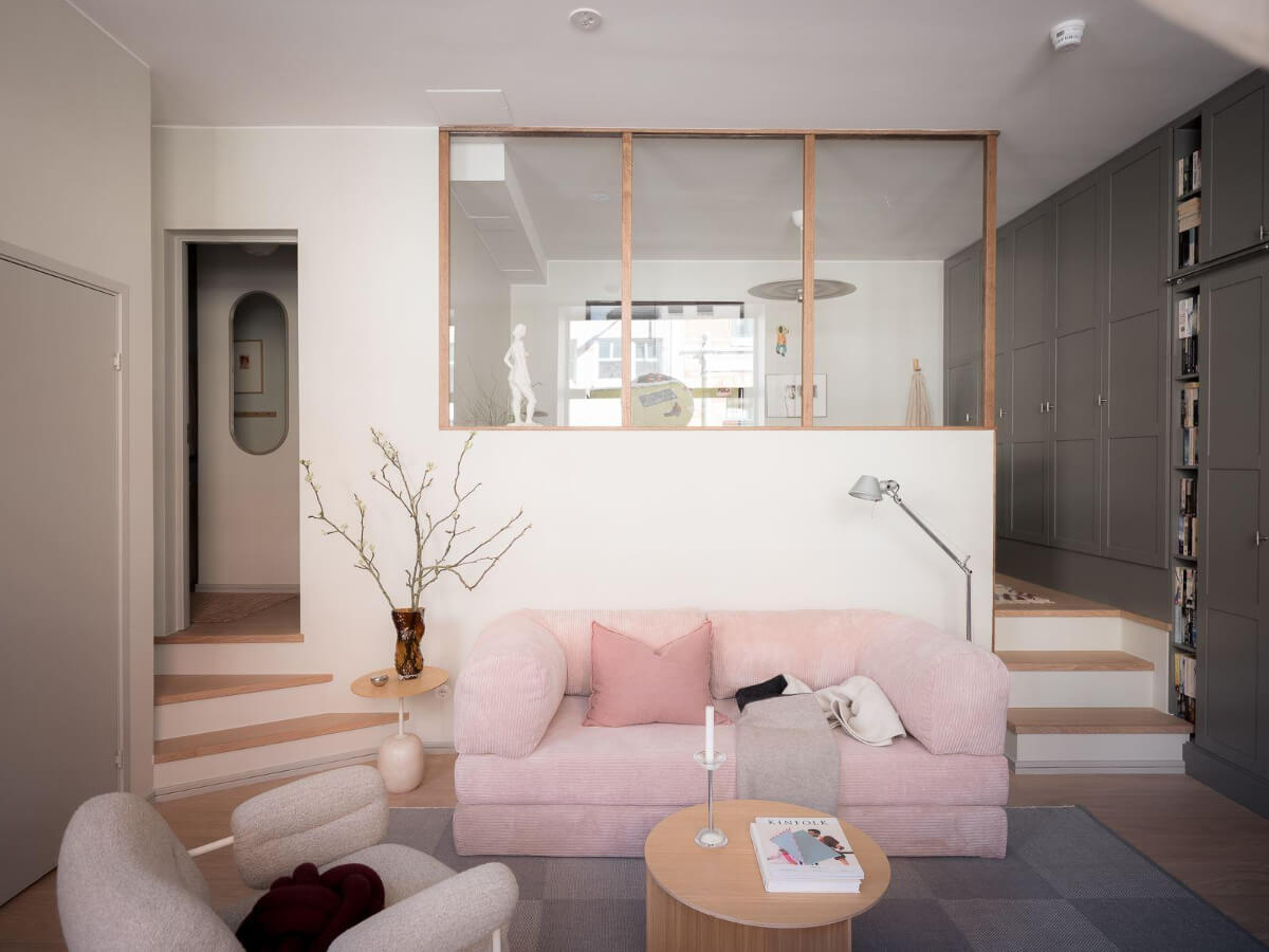 A Modern Split-Level Apartment in a Former Bakery 12 pink sofa sitting room split-level apartment