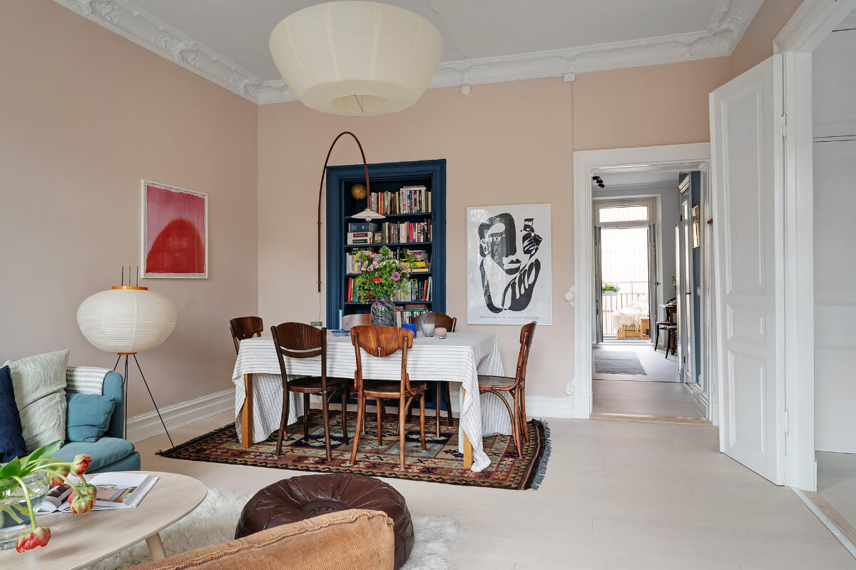 Pink and Blue Tones in a Late 19th-Century Apartment 6 pink walls living room blue bookcase dining table