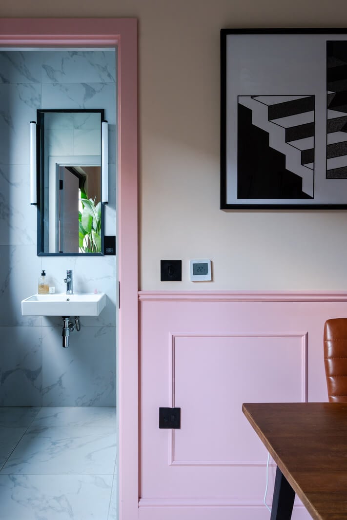 Arched Shapes and Hand-Painted Murals in a Joyful London Townhouse 15 pink walls view into bathroom