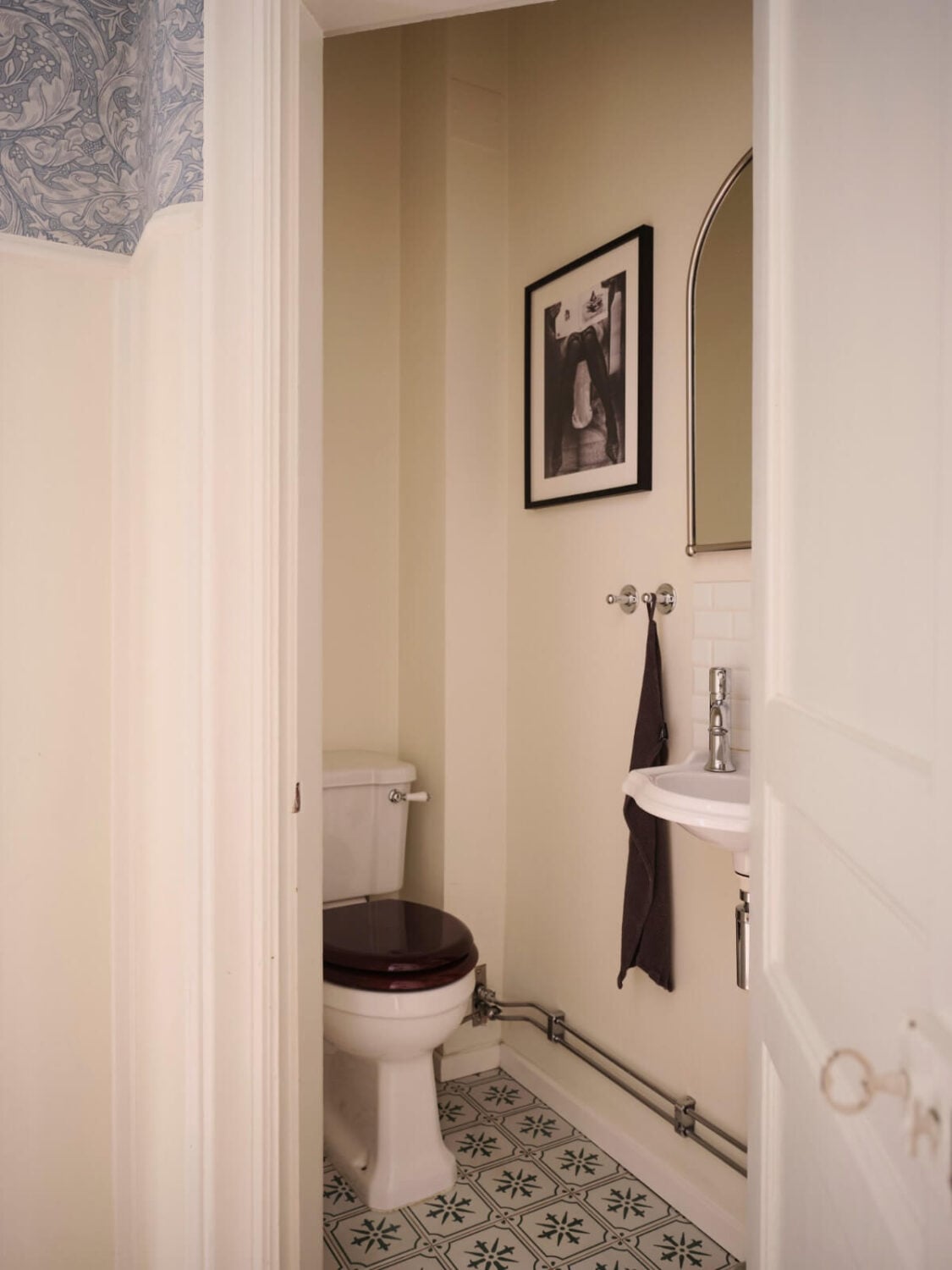 A Spacious Turn-of-the-Century Apartment with Nice Color Accents 33 powder room patterned floor tiles