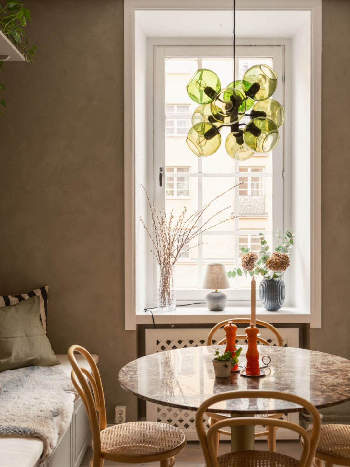 A Muted Palette and a Cozy Kitchen Breakfast Nook in a Swedish Apartment 11 round kitchen table built-in bench