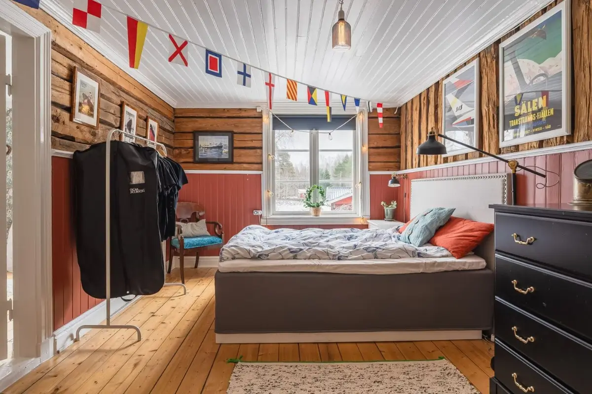 A Cozy Country House in Sweden Filled with Wallpapers 25 rustic bedroom red wall paneling