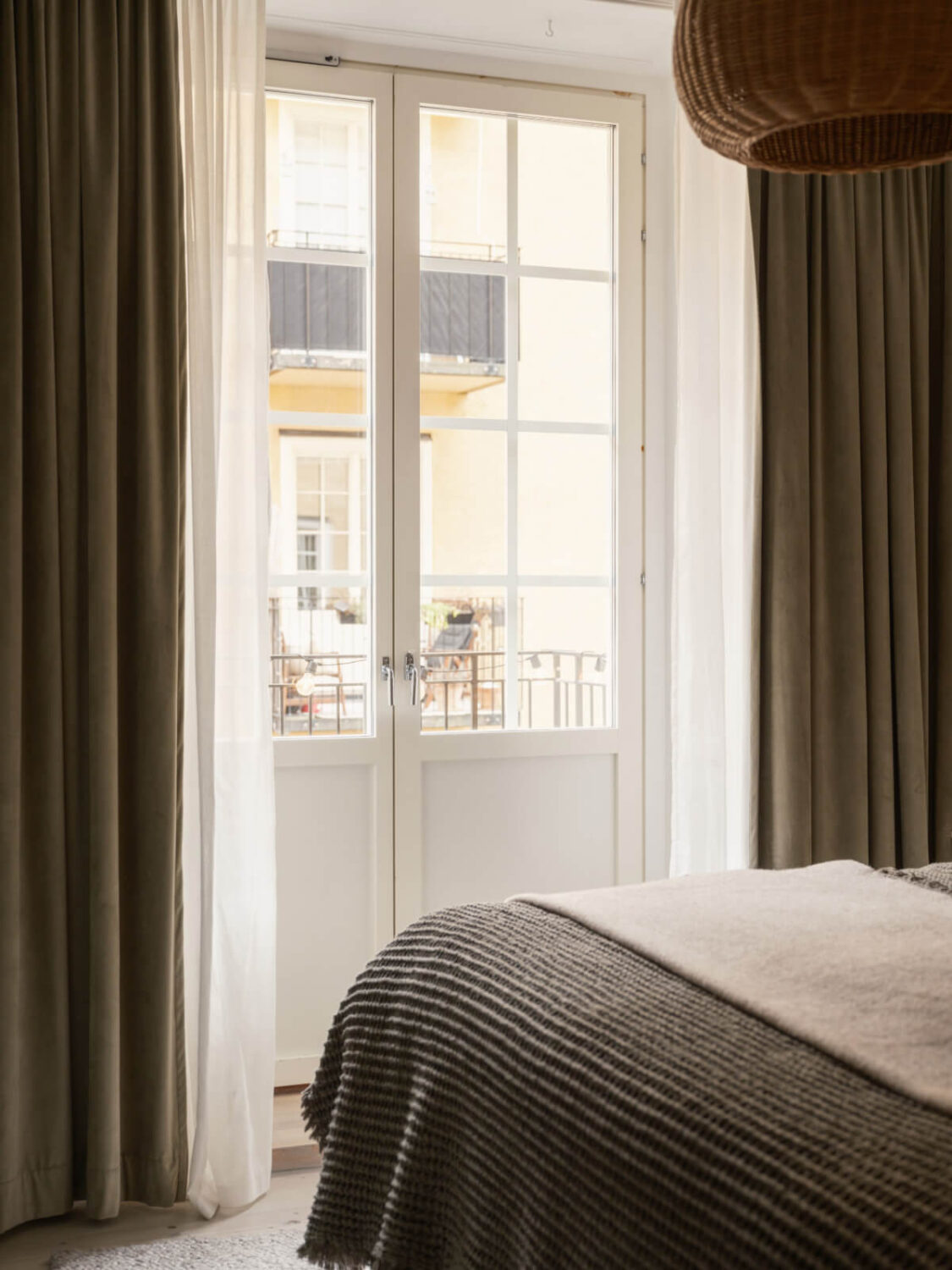 A Muted Palette and a Cozy Kitchen Breakfast Nook in a Swedish Apartment 16 scandi bedroom glass balcony doors