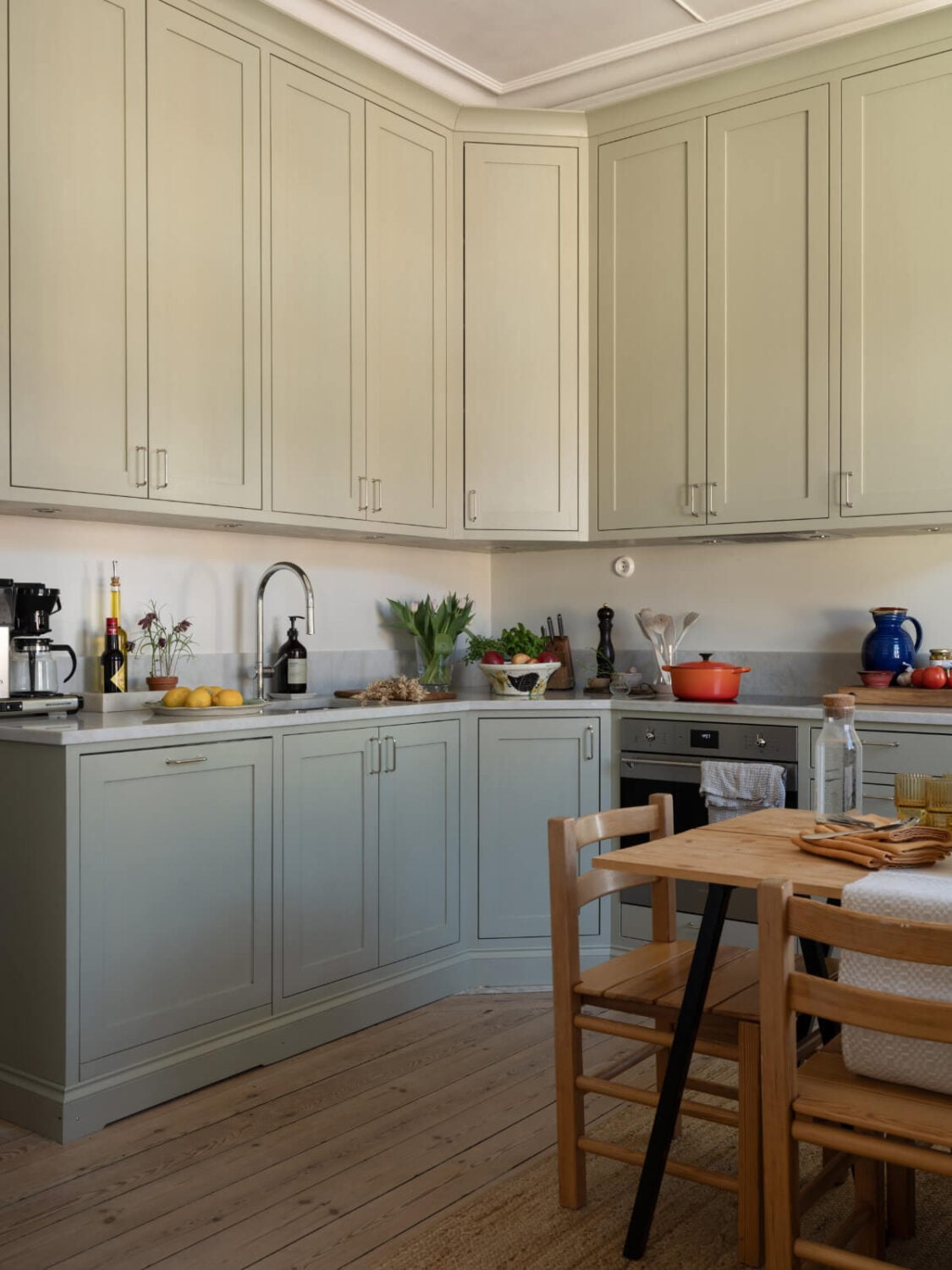 Turn-of-the-Century Charm and Site-Built Storage in a Stockholm Apartment 11 scandi kitchen wooden floor dining table
