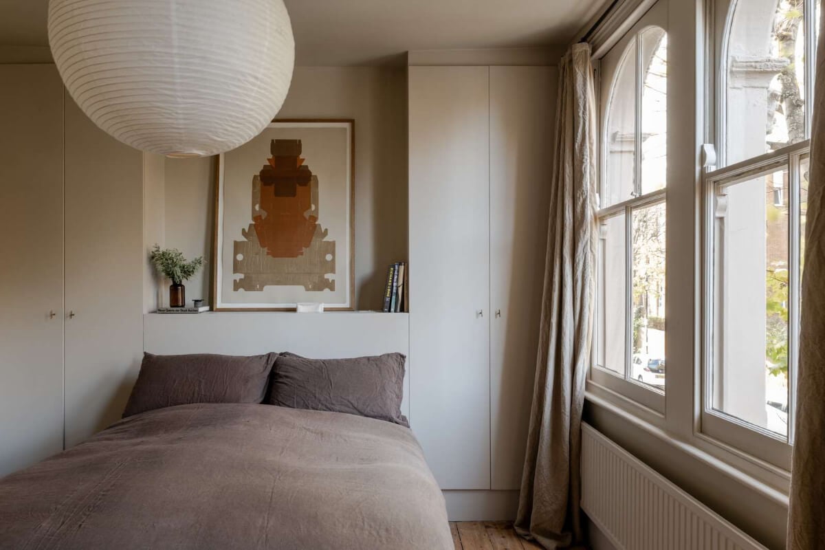 Natural Materials and Period Features in a Restored Victorian House 15 serene bedroom custom headboard with wardrobes