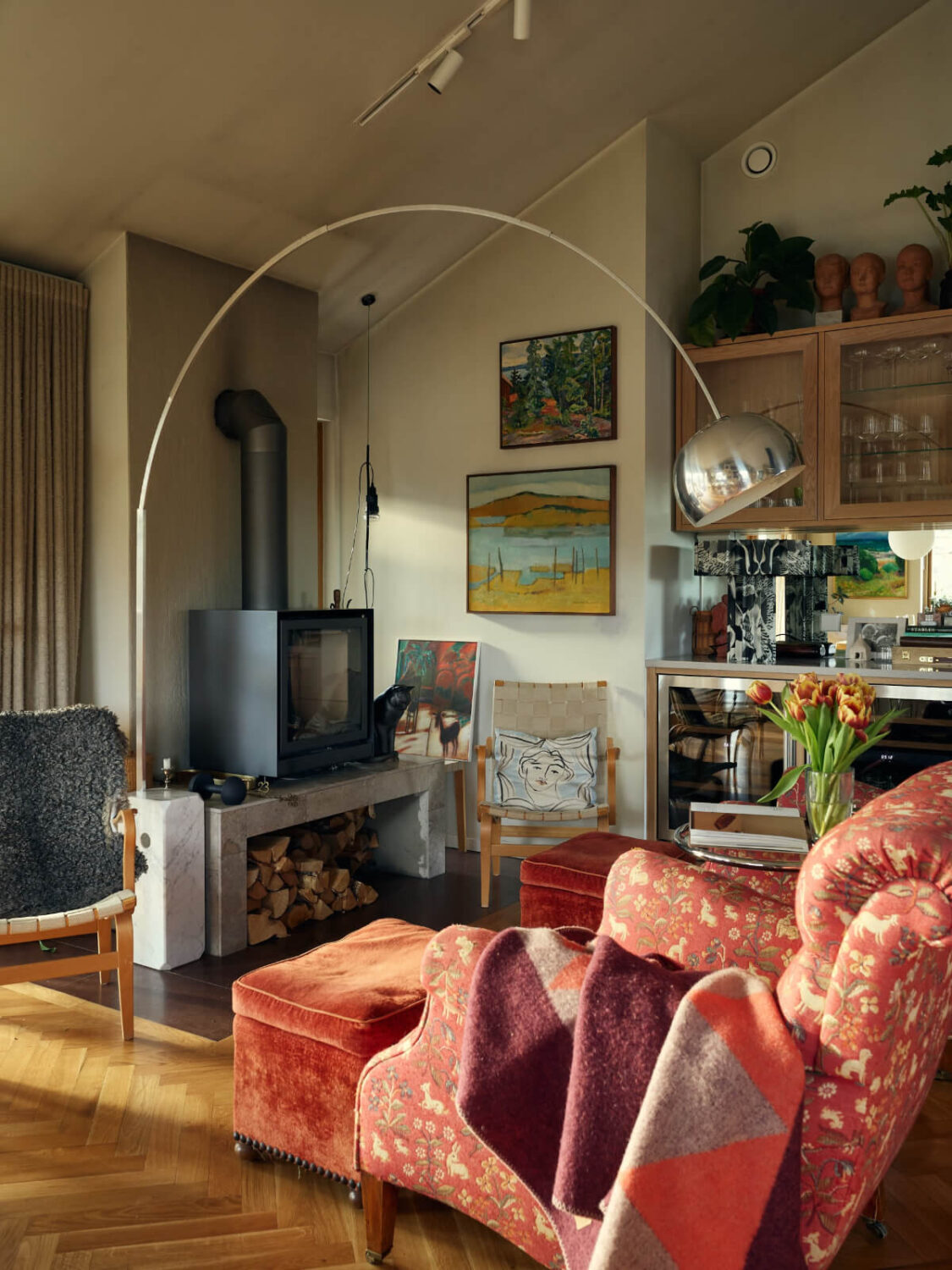 A Personal and Cozy 1960s Family Home in Sweden 9 sitting area vintage chairs wood burner